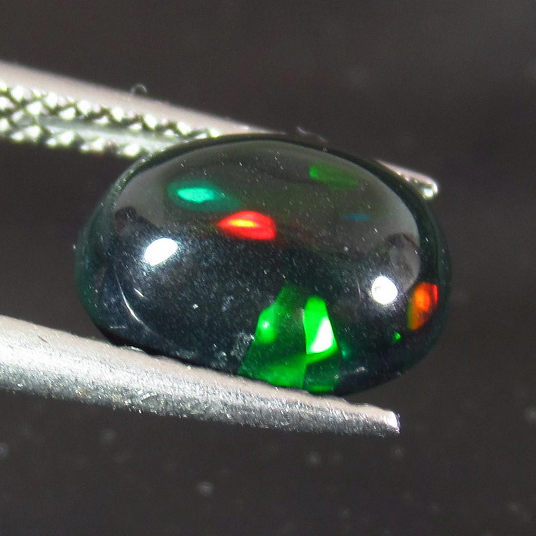 1.28 Ctw Natural Ethiopian Black Fire Opal Oval Cab: No Reserve! Title: 1.28 Ctw Natural Ethiopian Black Fire Opal Oval Cab Stone Clarity: Translucent Gemstones: Black Opal Size/Dimensions: 1.28 Carat Weights: 9.20 x 7.10 x 4.10 mm Additional Informatio