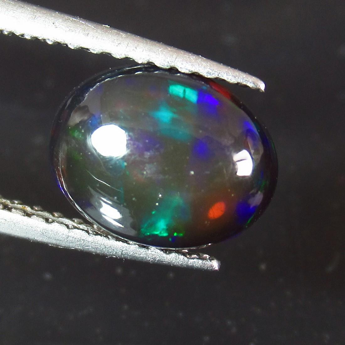 1.18 Ctw Natural Ethiopian Black Fire Opal Oval Cab: No Reserve! Title: 1.18 Ctw Natural Ethiopian Black Fire Opal Oval Cab Stone Clarity: Translucent Gemstones: Black Opal Size/Dimensions: 1.18 Carat Weights: 8.90 x 6.90 x 3.80 mm Additional Informatio