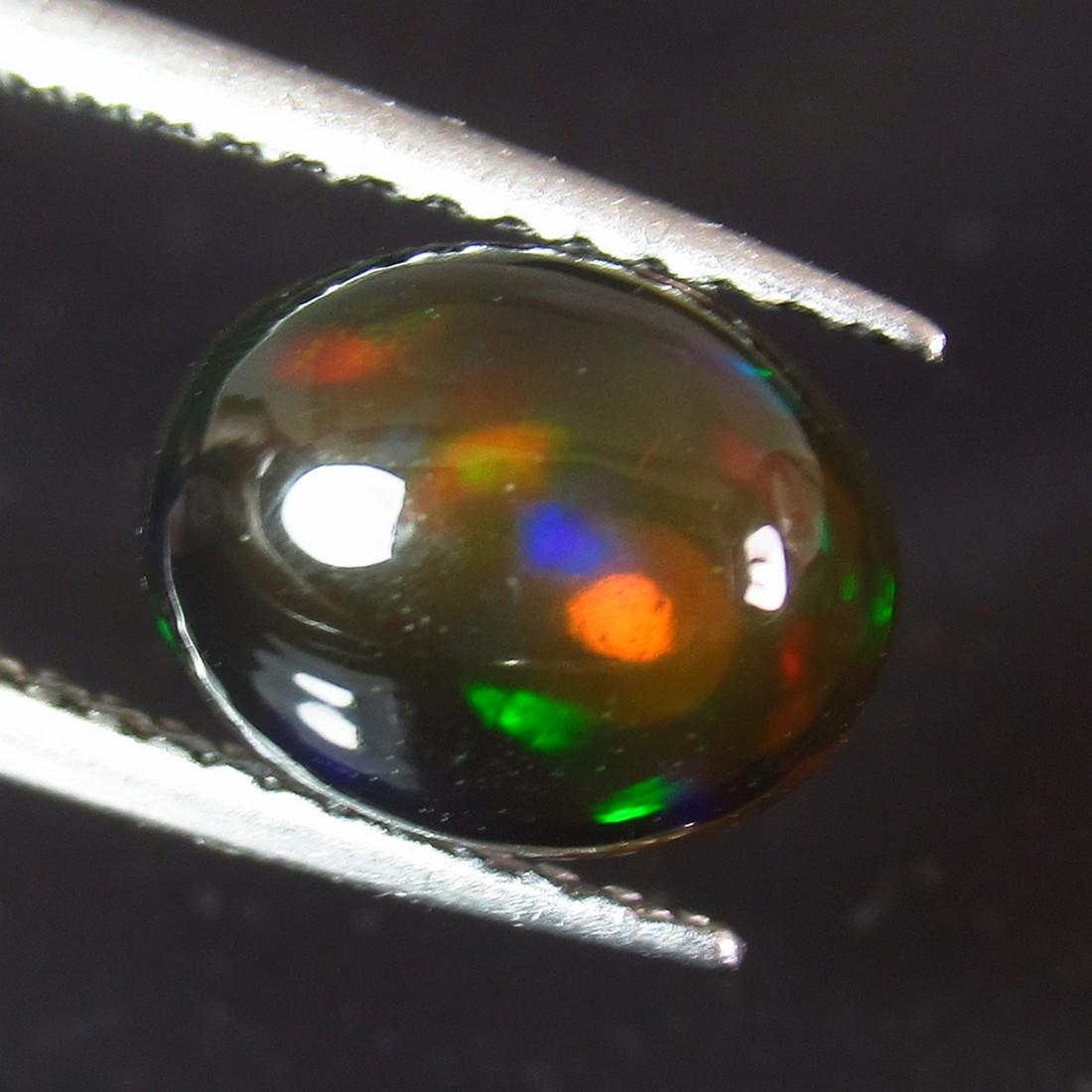 1.51 Ctw Natural Ethiopian Black Fire Opal Oval Cab: No Reserve! Title: 1.51 Ctw Natural Ethiopian Black Fire Opal Oval Cab Stone Clarity: Translucent Gemstones: Black Opal Size/Dimensions: 1.51 Carat Weights: 9.00 x 7.10 x 4.50 mm Additional Informatio