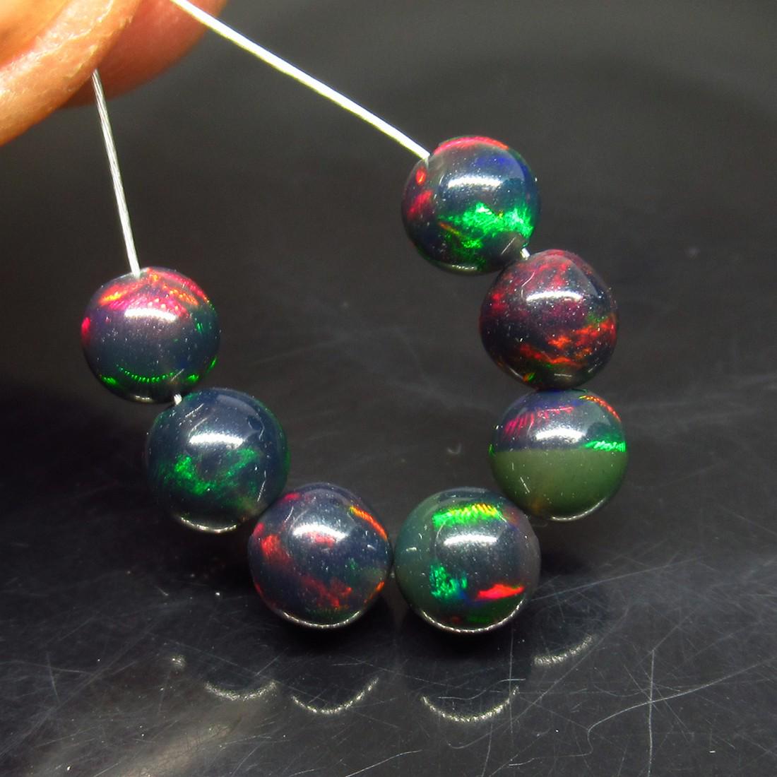 3.00 Ctw Natural 7 Drilled Black Opal Ball Beads: No Reserve! 3.00 Ctw Natural 7 Drilled Black Opal Ball Beads Shipping: Domestic: Flat-rate of $7.00 to anywhere within the contiguous U.S. International: Foreign shipping rates are determined by desti