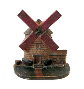 Windmill Doorstop: Title: Windmill DoorstopDate/Period: C 1920’sDimension: 7”H X 6 7/8”W X 2 5/8”D Material: Cast IronAdditional Information: Made by National Foundry, Whitman, MA, marked “10” backside