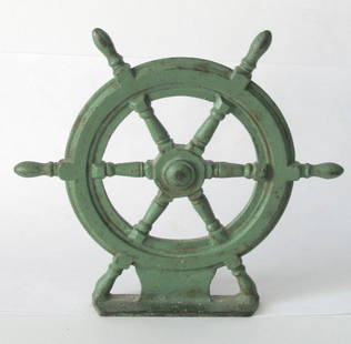 Nice vintage cast iron ship: Title: Nice vintage cast iron ship's wheel doorstop. Description: Nice vintage cast iron ship's wheel doorstop in original green paint. Marked on the back "Spencer Guilford, Conn.” Dimension: 7” x