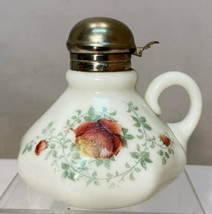 Syrup Jug: Title: Syrup JugDimension: 5”Provenance/additional info: A short and squat syrup jug made from blown milk glass. Decorated with a floral transfer design. Ca. 1890. Shipping:Domestic: Flat-rate of