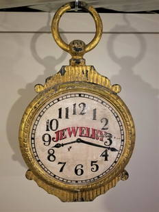 Small Watch Trade Sign In Metal And Wood: A small size, 20 inches x 12 inches. The top and bottom are cast iron and the ring is cast in zinc and the face is carved wood. Double sided. The face is in original paint. Th metal is old second