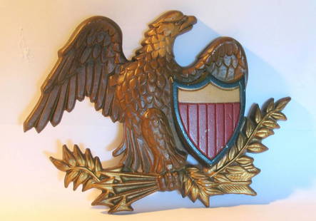 Vintage cast metal eagle & shield wall decoration.: Title: Vintage cast metal eagle & shield wall decoration.Description: Nice vintage cast metal wall decoration of a spread wing eagle & patriotic shield in great original paint.Dimension: 8 1/2”