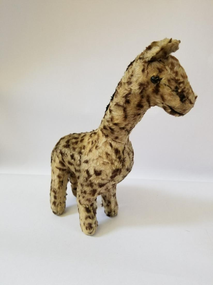 1950s plush giraffe, straw-stuffed: Title: 1950s plush giraffe, straw-stuffed Dimension: 12" high Provenance/Additional Info:Shoe button eyes. Some wear. Shipping: Domestic: Flat-rate of $10.00 to anywhere within the contiguous U.S. Int
