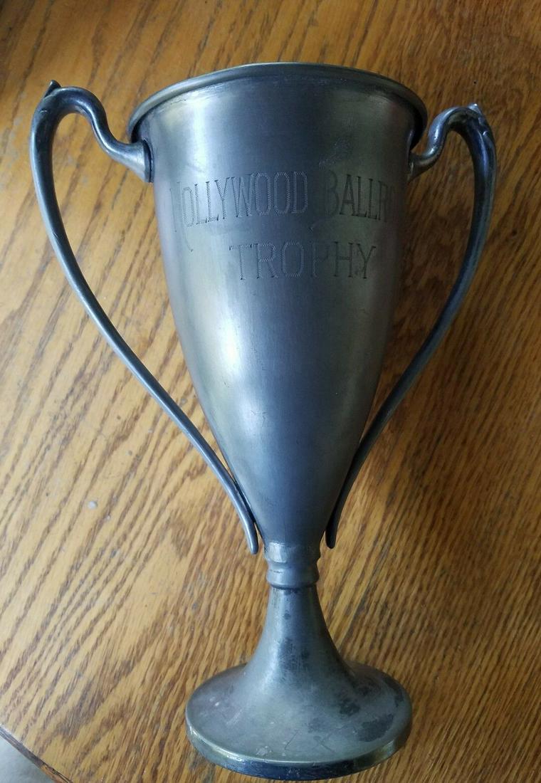Hollywood hay shakers ballroom dance dancing Trophy: Great looking piece in very good condition. Nice subject matter . List of names. Has a repair at thinnest part where base and body meet . Barely noticeable. Measures 9" tall . Shipping costs include i