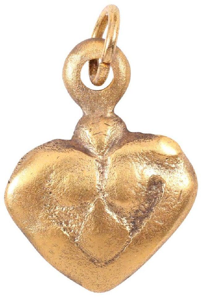 FINE VIKING HEART NECKLACE C.850-950 AD: Gilt bronze. Over 7/8" height. Elegantly formed with broad border and trefoil motif. Foliate designs were favored by Vikings and incorporated into about half of the heart pendants. The heart stood for