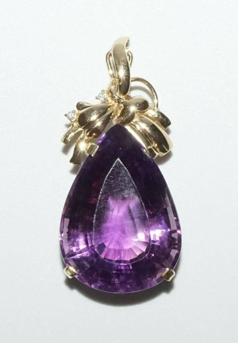 Vintage 14k Yellow Gold Pendant set Large Pear Amethyst: Up for sale from a recent estate in Honolulu Hawaii, this Vintage 14k yellow gold pendant that is set with 1x large facetted pear shaped purple amethyst (approx. 28mm x 20mm). The condition is describ