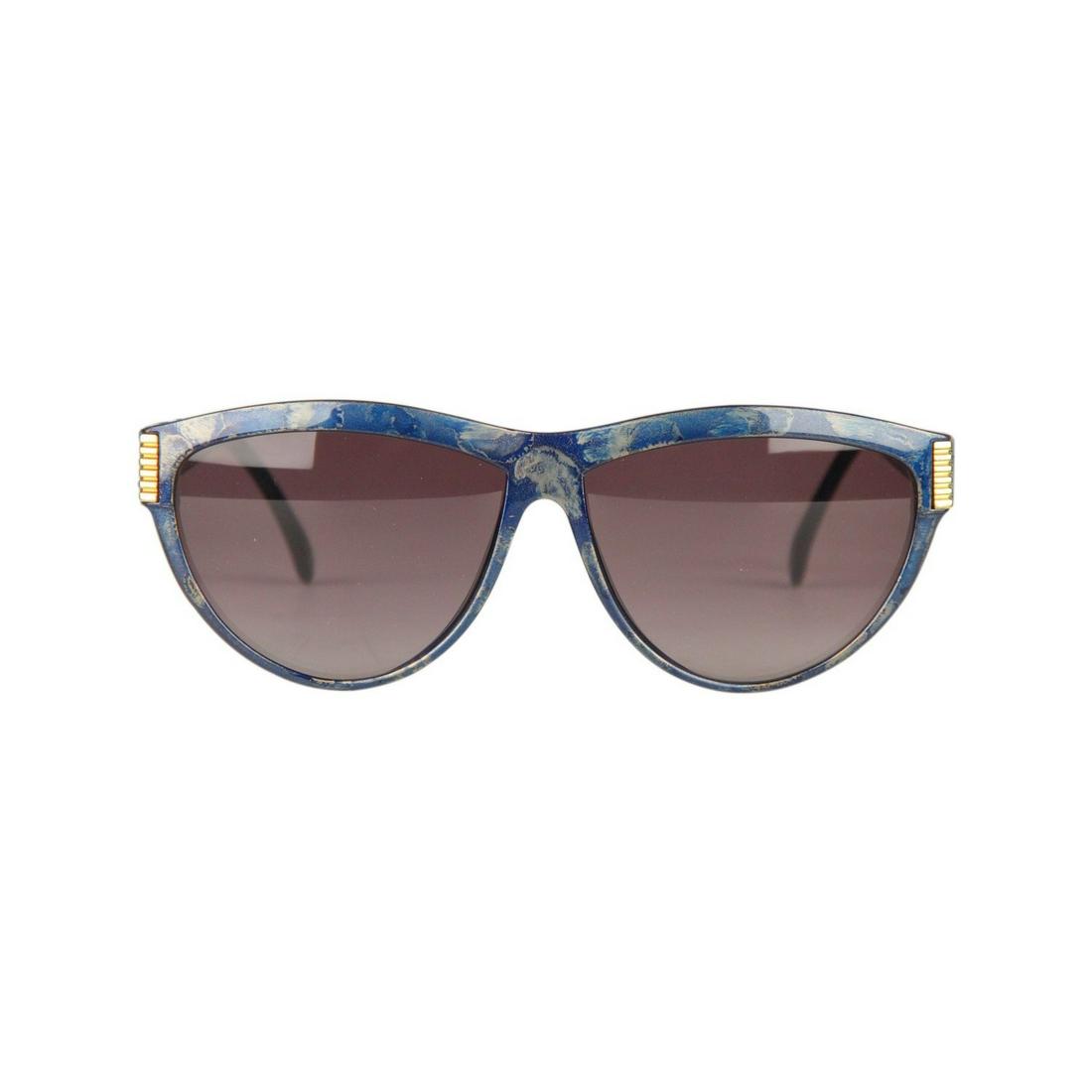 Yves Saint Laurent Vintage Blue Marbled Sunglasses 9045: Elegant original Vintage 1980s Sunglasses by YVES SAINT LAURENT Oversize frame Marbled Blue effect with gold metal hardware Smoke Blue Gradient 100% UV protection NEW lens YSL gold metal side logos Fr
