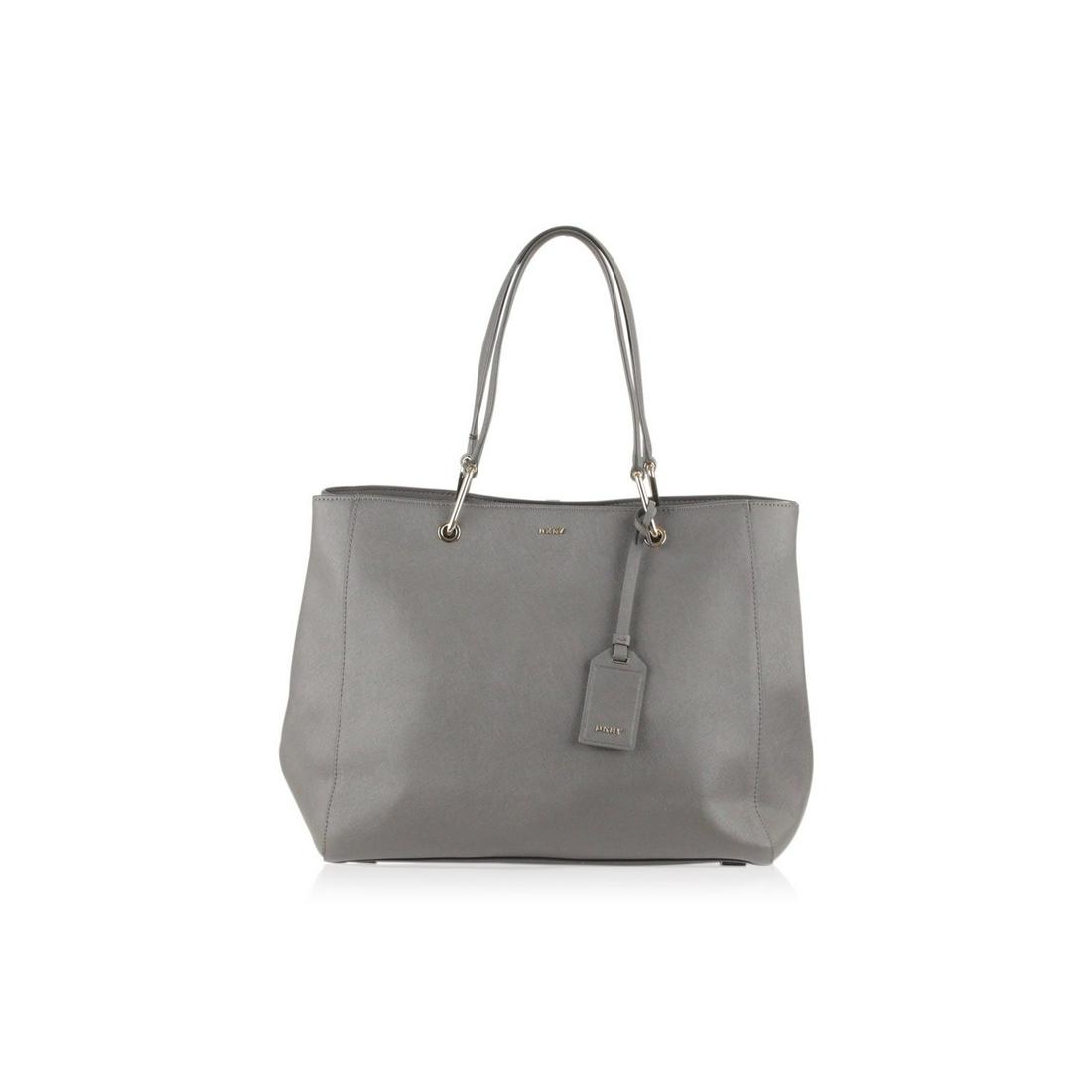 Donna Karan DKNY Gray Saffiano Leather Tote Bag: - Gray Saffiano Leather - Gold metal hardware - Magnetic button closure on top - Black abric lining - 1 side zip pocket and 2 side open pockets inside - 4 bottom feet - Gold metal 'DKNY' lettering on