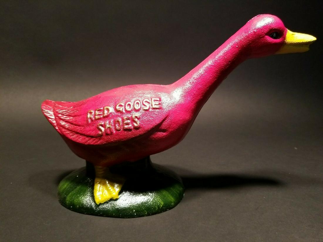 Cast Iron Red Goose Shoes Coin Bank: 9 1/2" long x 6 1/2" tall Such a charming reproduction cast iron "Red Goose Shoes" statue coin bank. Nice quality! All solid cast iron hand painted. As you can see the coin slot is located on the top