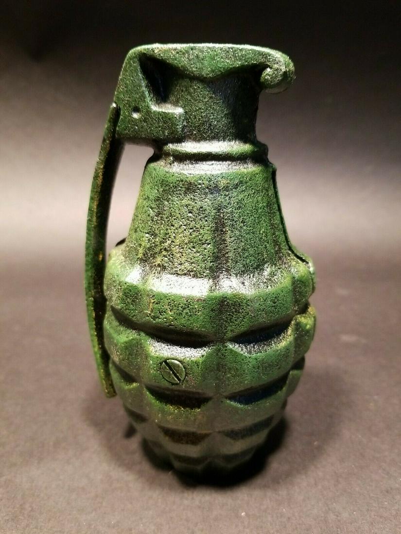 Cast Iron Grenade Coin Bank: 6" Long x 3 1/2" Wide Great reproduction cast iron coin bank. This piece was made to look just like an antique, but is actually new. All our items come with a 100% customer satisfaction guarantee. Abo