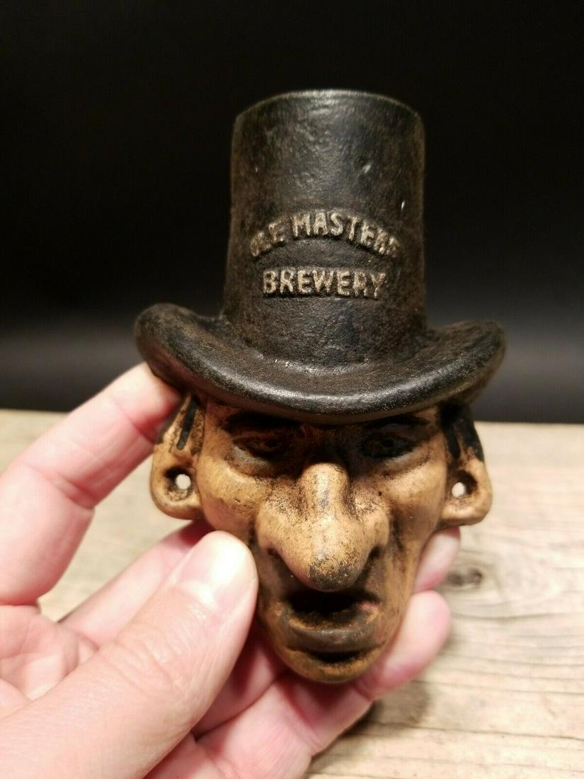 Cast Iron Ole Masters Folk Art Figural Beer Bottle: 3 5/8" Tall x 3 1/2" Wide Great reproduction cast iron bottle opener. This piece was made to look just like an antique, but is new. All of our items come with a 100% customer satisfaction guarantee. A