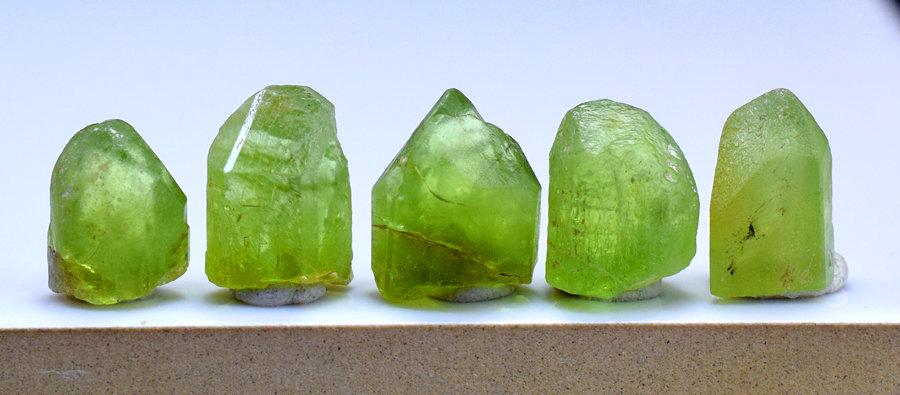 Peridot Crystals , Terminated Damage Free Olivine: Gem type: Peridot Description Peridot Crystals , Terminated Damage Free Olivine Peridot Crystal From Sapat Pakistan - Weight : 35.60 Carats Size : 12*18*07 mm , 10*08*06 mm Treatment : Natural Origin 