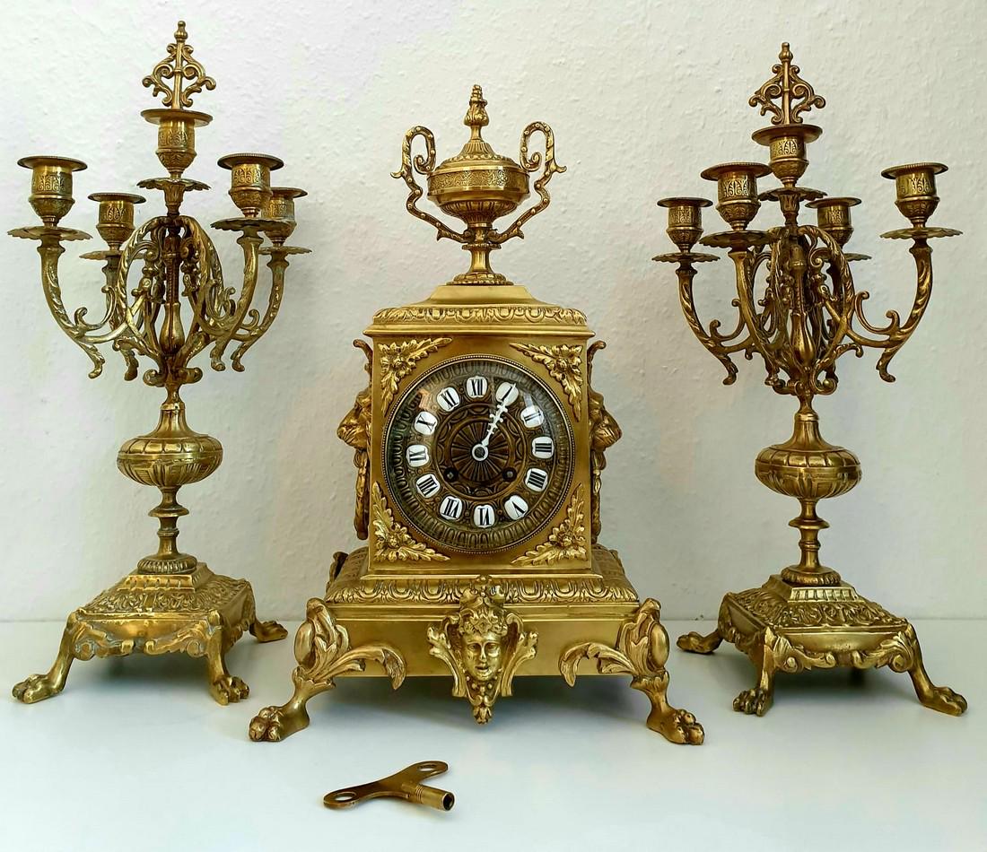 French Mantel Gild Bronze: Title: French Mantel Gild Bronze Desciption: Beautyful Clock, Amazing Sculptures, Medusa, Lions, And two Gild Candelabrass, Eight work days, Original Key, Pendulem same number as the key. Every half H