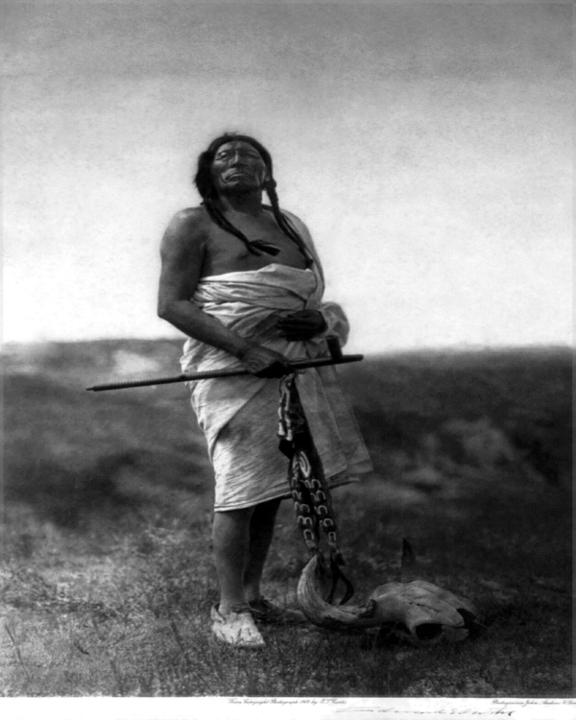 1907, "THE MEDICINE MAN (SLOW BULL)", BY CURTIS: Title: 1907, "THE MEDICINE MAN (SLOW BULL)", BY CURTIS Artist/Source: EDWARD SHERIFF CURTIS, (AMERICAN, 1868-1952) Date/Period: 1907 (ORIGINAL SOURCE) Medium: PUBLISHED CONTEMPORARY PHOTO-LITHOGRAPH, 