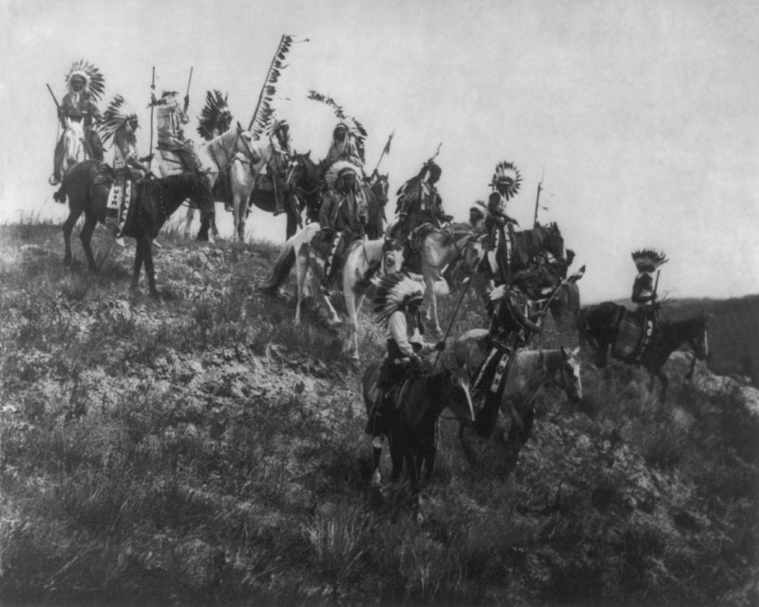 1907, "OGLALA WAR PARTY"; EDWARD CURTIS: Title: 1907, "OGLALA WAR PARTY"; EDWARD CURTIS Artist/Source: EDWARD SHERIFF CURTIS Date/Period: 1907 (ORIGINAL SOURCE) Medium: PUBLISHED CONTEMPORARY PHOTO-LITHOGRAPH, WITH RESTORATION; AFTER CURTIS'