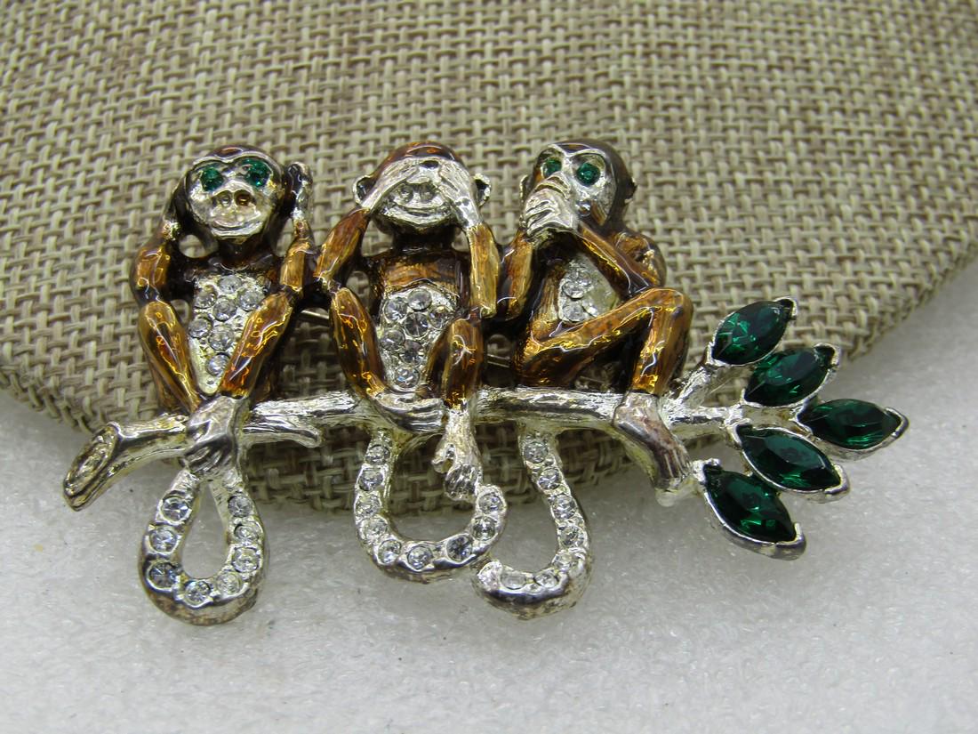 Vintage 3 Monkey Rhinestone Brooch, Hear, See, Speak No: Vintage 3 Monkey Rhinestone Brooch, Hear, See, Speak No Evil, Enameled, 2.5" by 1.5", Silver tone. Green marquise rhinestone leaves with three monkeys with rhinestones in their tails and bellies - two