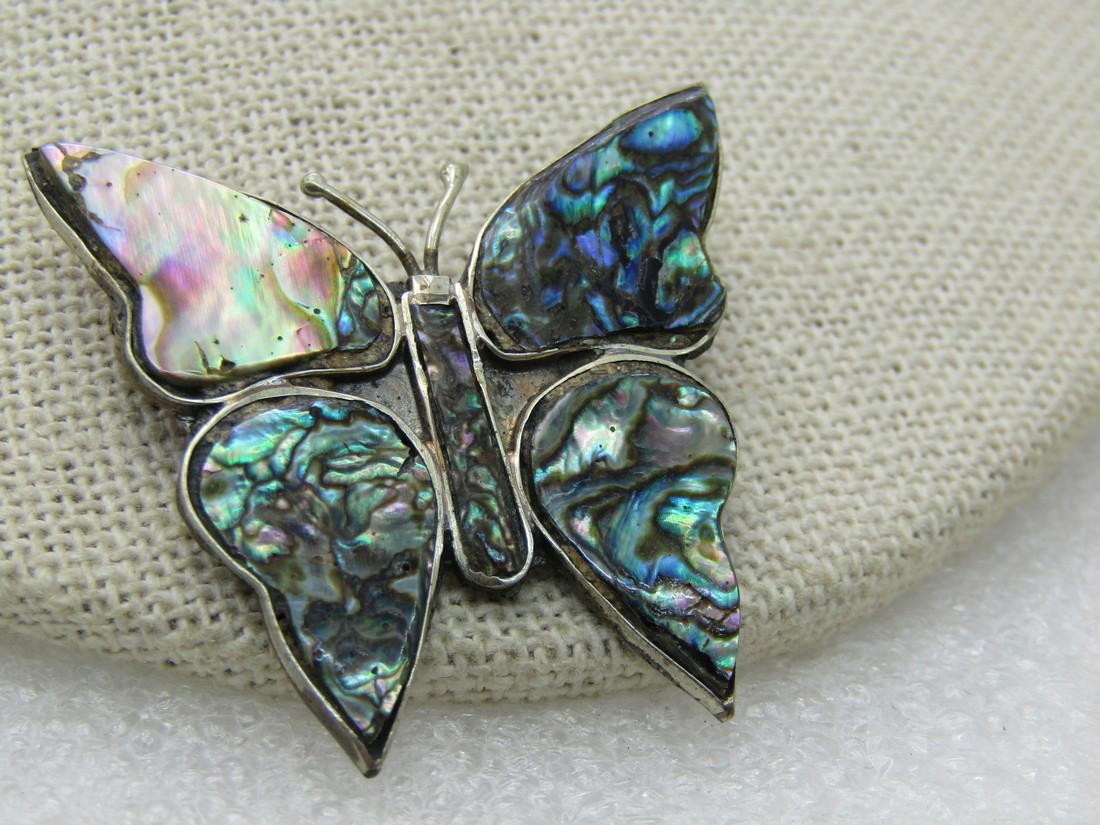 Vintage Mexican Abalone Butterfly Brooch, Alpaca, 1.5": Vintage Abalone Butterfly Mexican Brooch, Alpaca, 1.5" wide and 1.25" tall. Signed hecho in Mexico and marked Alpaca - not sterling but an alloy that looks like sterling. 1960's-1970's. Very good cond