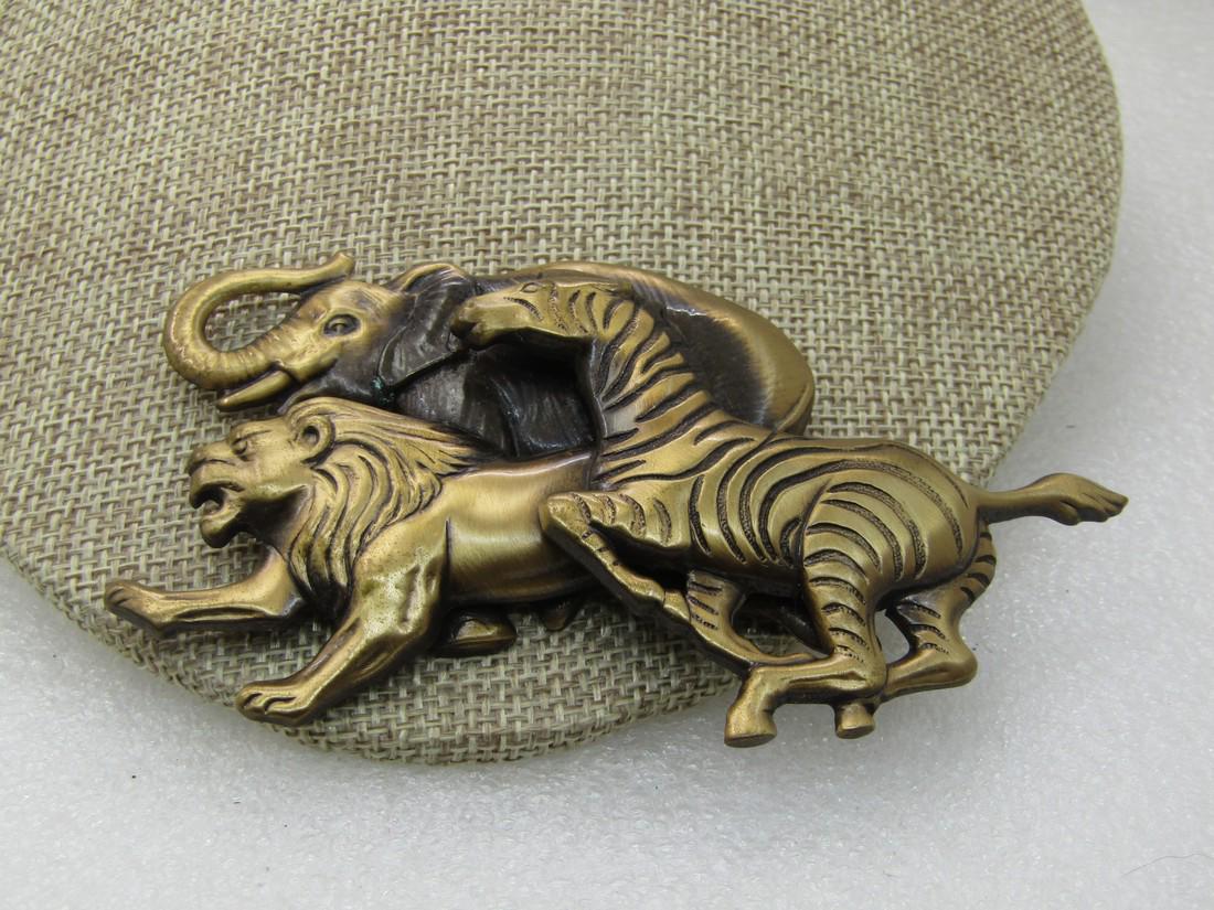 Vintage Safari Animal Stampede Brooch, 4.25" by 2",: Vintage Safari Animal Stampede Brooch, 4.25" by 2", Elephant, Lion, Zebra, pressed brass-like metal with a washed finish to add to the detail. Large and in charge statement brooch. Very good condition
