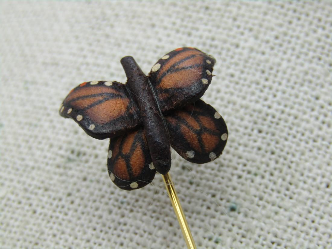 Vintage Orange Monarch Butterfly Stick Pin, 1970's,: Vintage Leather Orange Monarch Butterfly Stick Pin, 1970's, Gold Tone. 3.25" long with safety cap. The butterfly is leather, curved and signed LB on back. 3/4" wide and tall. Age unknown but would est