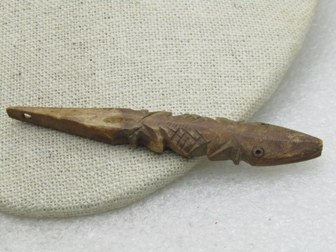 Carved Prehistoric Fish Bead, 3.25", Brown, Unknown Age: Carved Prehistoric Fish Bead, 3.25", Brown, Unknown Age - unknown if stone or bone and also uncertain if this is current or true vintage. It is appx. 1/2" and wider at the back of the head. See photos