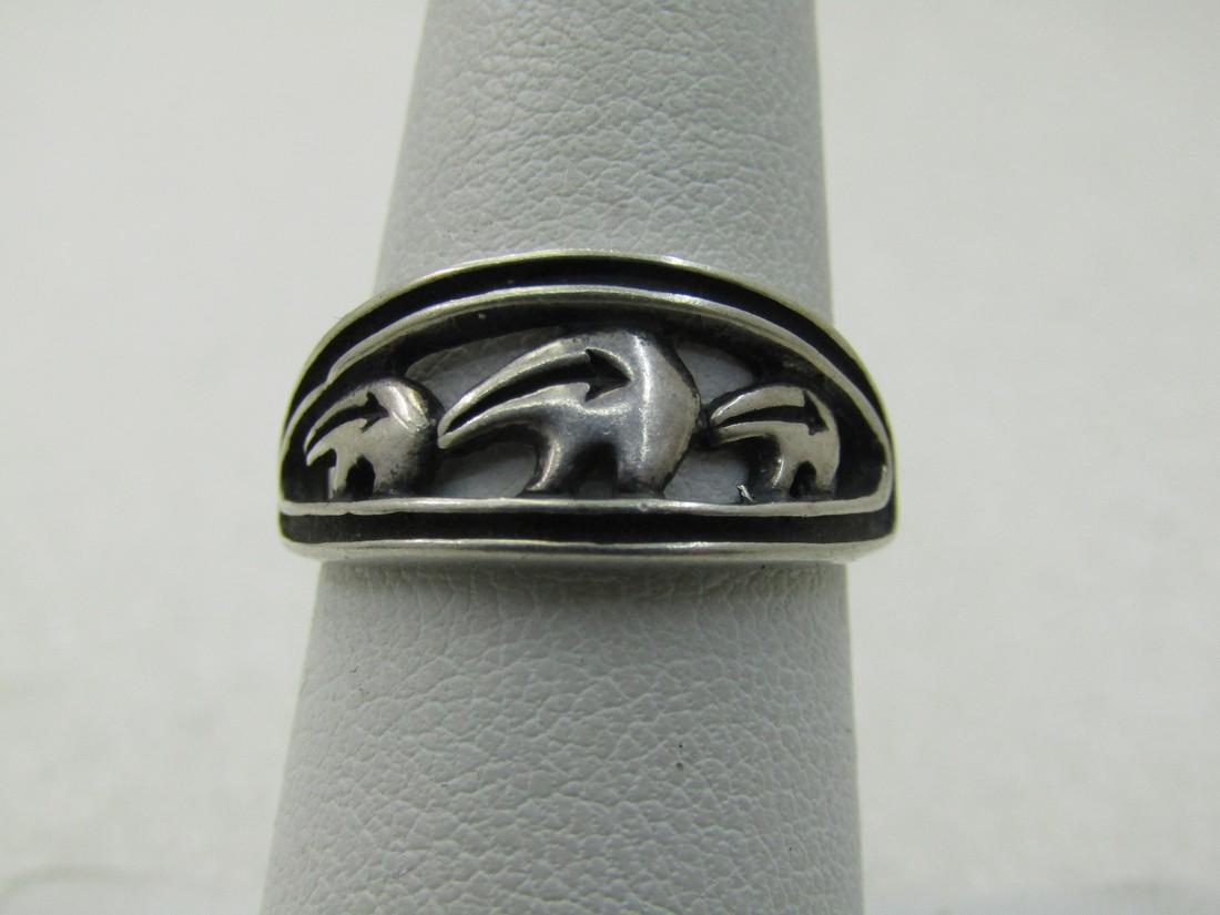 Vintage Sterling Silver Southwestern Bear Ring, Sz. 7: Vintage Sterling Silver Southwestern Bear Ring, Sz. 7. The ring has a cut-out of three bears in a recessed seting with raised double edges frame in a oval design. The weight of the ring is appx. 3.30 