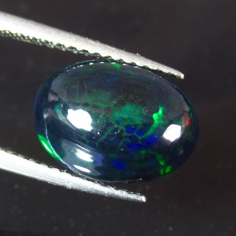 1.94 Ctw Natural Ethiopian Black Fire Opal Oval Cab: No Reserve! Title: 1.94 Ctw Natural Ethiopian Black Fire Opal Oval Cab Stone Clarity: Translucent Gemstones: Black Opal Size/Dimensions: 1.94 Carat Weights: 11.50 x 8.40 x 4.50 mm Additional Informati