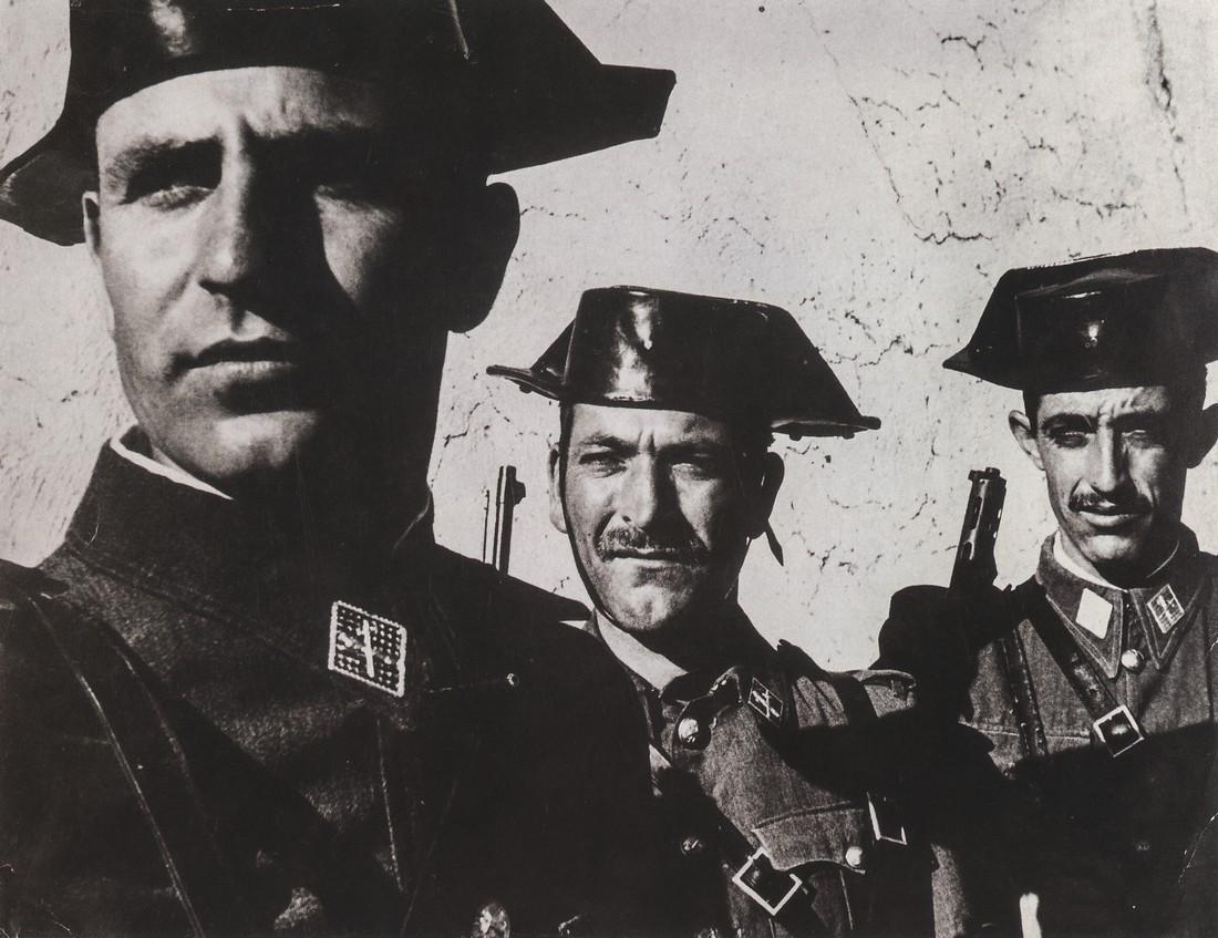 W. EUGENE SMITH - Spanish Civil Guard, 1950: Artist: W. EUGENE SMITH Title: Spanish Civil Guard, 1950 Medium:Photo Litho, 1995, USA Dimensions: 7.5x5.75" Description: Heat Wax Mounted on 8.5x11" Conservation Board Artist Bio: W. Eugene Smith (19