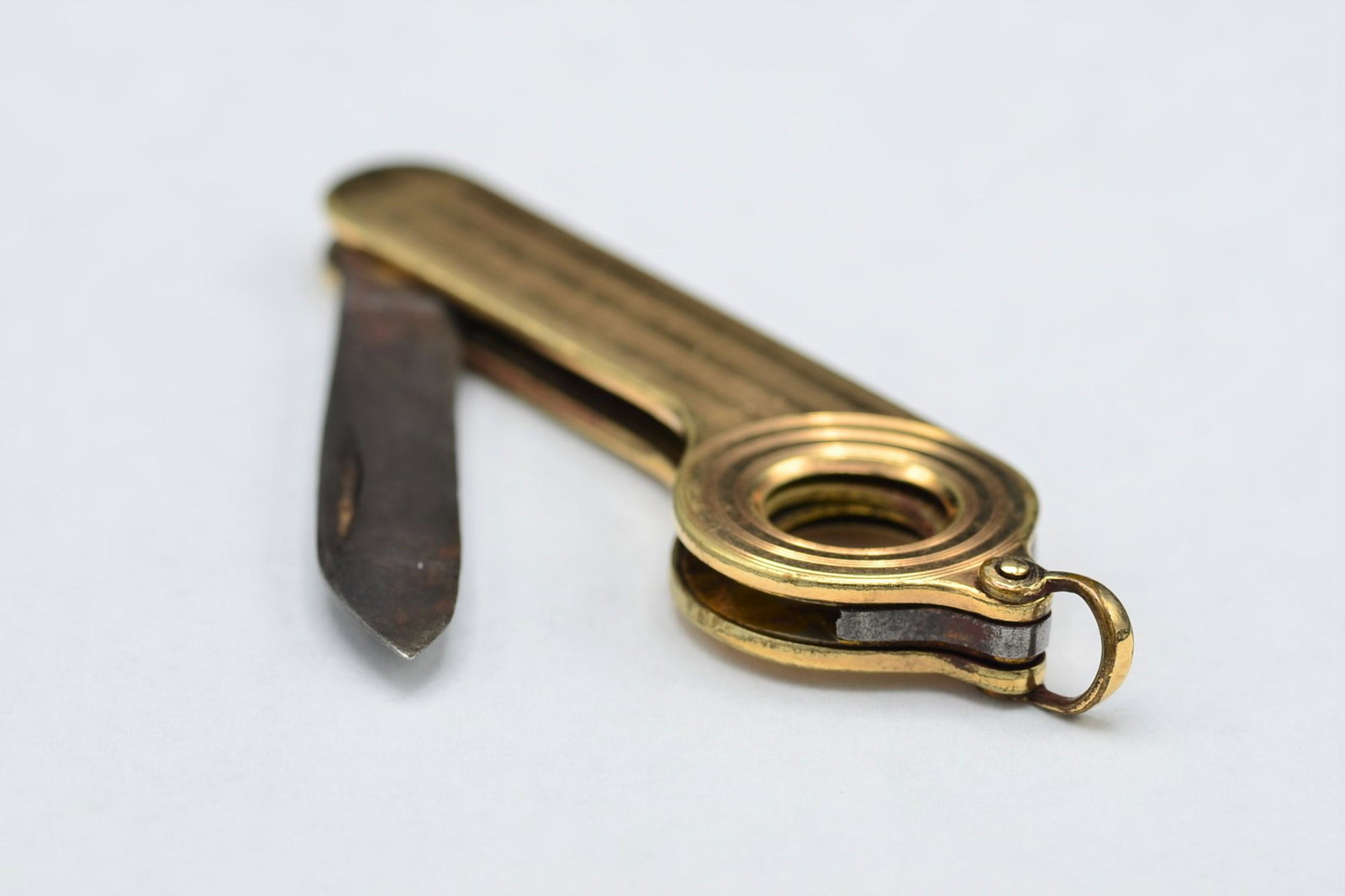 Empire Winsted CT. Signed Gold Filled Cigar Cutter and: Title: Empire Winsted CT. Signed Gold Filled Cigar Cutter and Penknife Combination Metal Purity: GF Gold Weight: 12.2 Size/Dimensions: 2.5" Additional Information: Empire Winsted CT. Signed Gold Fille