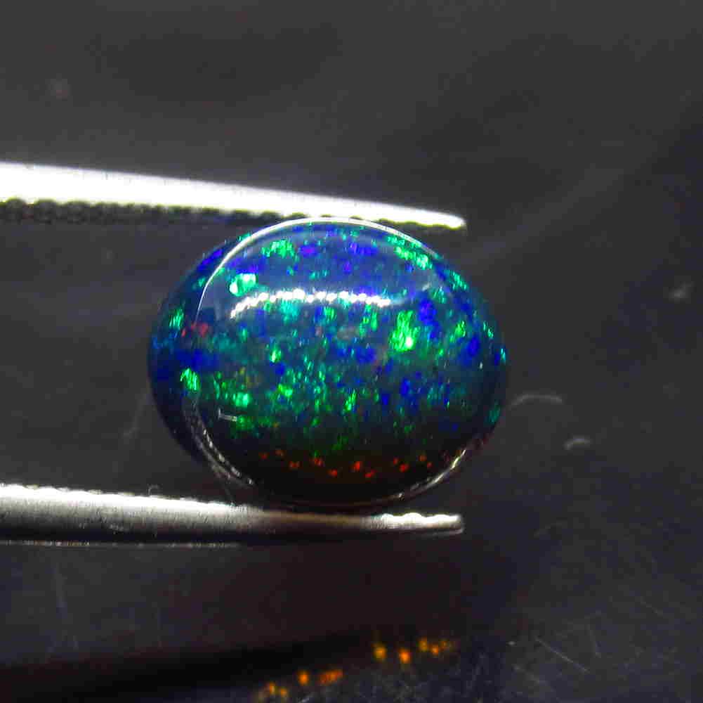 2.23 Ct Natural Ethiopian Black Fire Opal Oval Cab: Title: 2.23 Ct Natural Ethiopian Black Fire Opal Oval Cab Stone Clarity: Translucent Gemstones: Natural Black Opal Carat Weights: 2.23 Size/Dimensions: 10.50 x 8.60 x 5.30 mm Additional Information: E