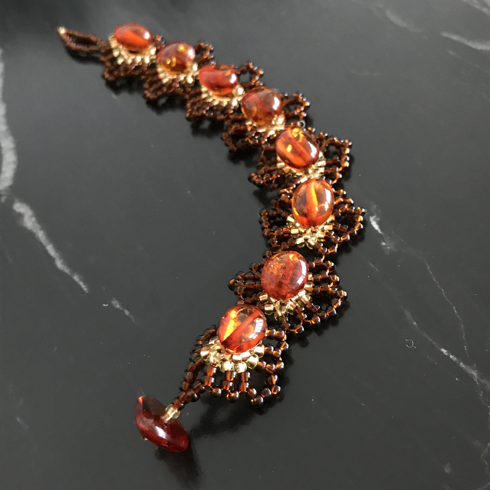 Fascinating Amber Bracelet made from Oval shaped Amber: Title: Fascinating Amber Bracelet made from Oval shaped Amber beads Metal: None Gemstones: Amber Weight: 8.4 g Size: Size: 22.0 x 160.0 x 7.0 mm Size: 0.866 x 6.299 x 0.276 inches Bead size: 7.1 x 9.8