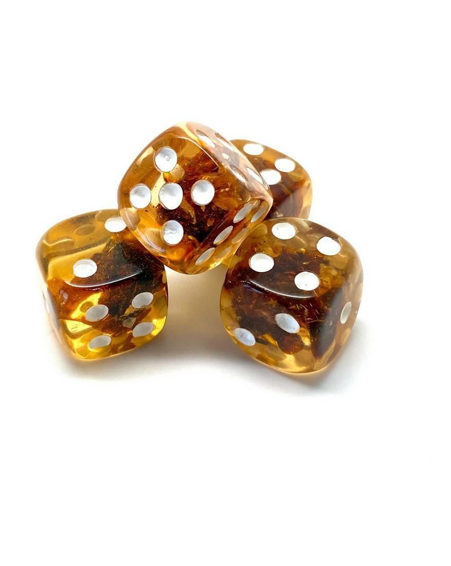 Unique and Incredible Amber Set of 4 Dices: Title: Unique and Incredible Amber Set of 4 Dices Maker: Unknown Origin: Unknown Date/Period: Unknown Materials: Reconstituted Amber Size:Size: 16.5 x 16.5 x 16.5 mm Size: 0.65 x 0.65 x 0.65 inches 21