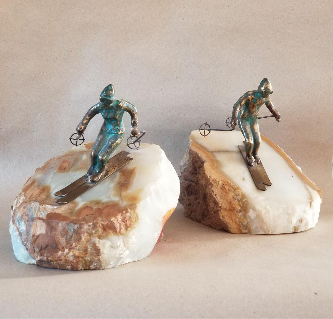 Mid Century Curtis Jere Ski Sculpture: Title: Mid Century Curtis Jere Ski Sculpture Maker: Curtis Jere Origin: Date/Period: 1950s Materials: Bronze on onyx base Size:6 x 7 x 6 inches Description: Very beautiful pair of ski sculptures by Cu