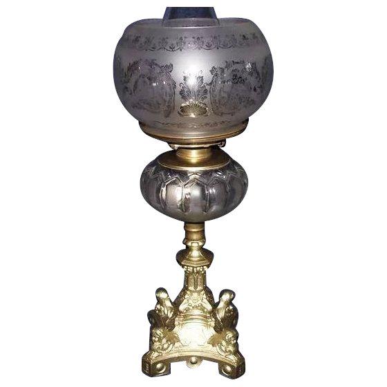 Semi-Frosted Glass Fount on a Four Cherub Headed Gothic: Title: Semi-Frosted Glass Fount on a Four Cherub Headed Gothic Baroque Dietz Catalog 1860's Base, complete with an Acid Etched Gothic Shade with Cherubs & Griffins !!! Description: Semi-Frosted Glass