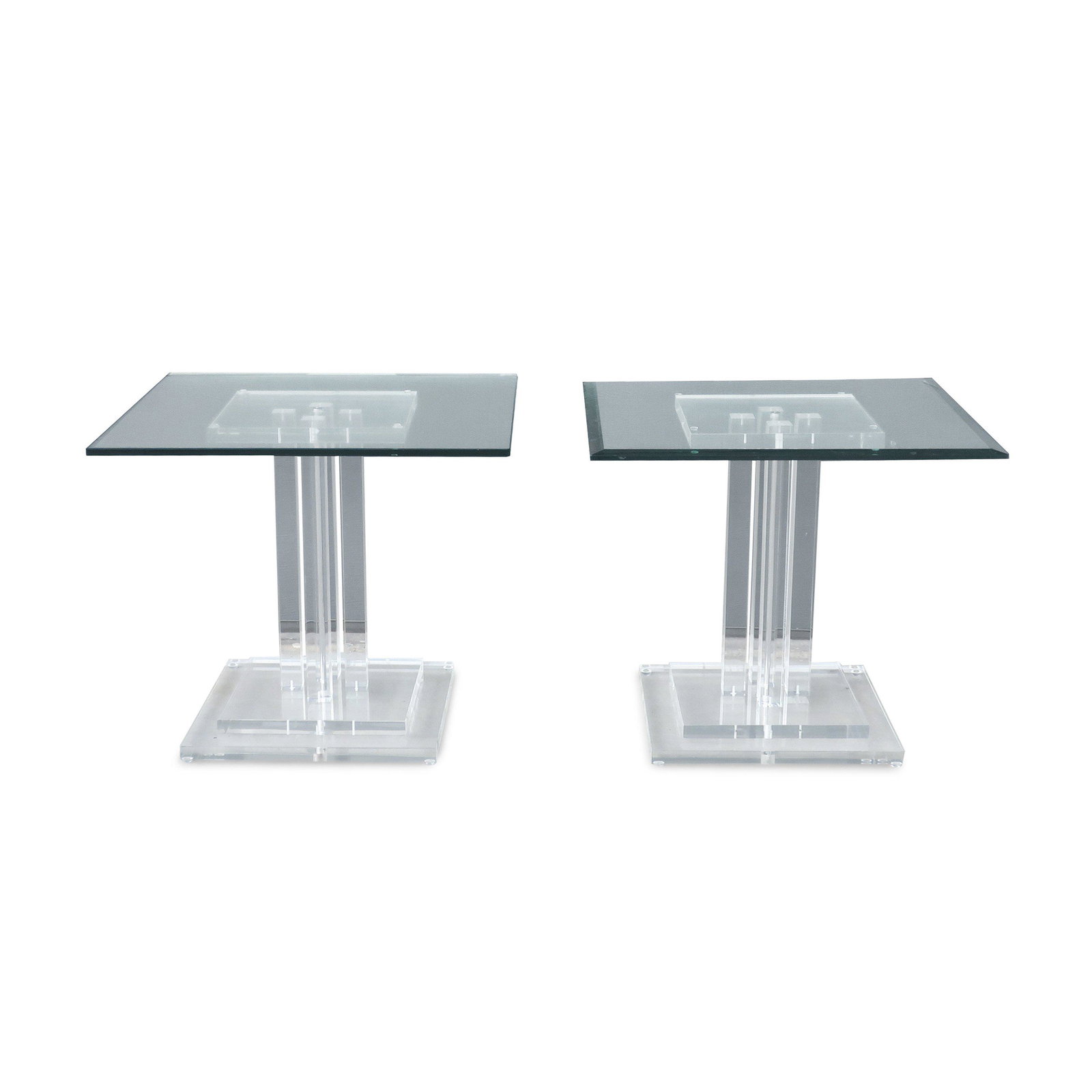 Pair of Vintage Skyscraper Lucite and Glass Side Tables: An amazing pair of matched mid-century modern lucite and glass side tables. Square glass tops sit on stacked geometric lucite bases and tops held up by four square lucite columns and a thin chrome cyl