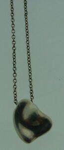 TIMELESS Tiffany & Co. Elsa Peretti Sterling Silver: DK Tiffany & Co. Sterling Silver Elsa Peretti Heart Necklace · Wonderful necklace that is a necessity in your collection. · The weight is 3.3 grams. · The length of the chain is 16 inches. The leng