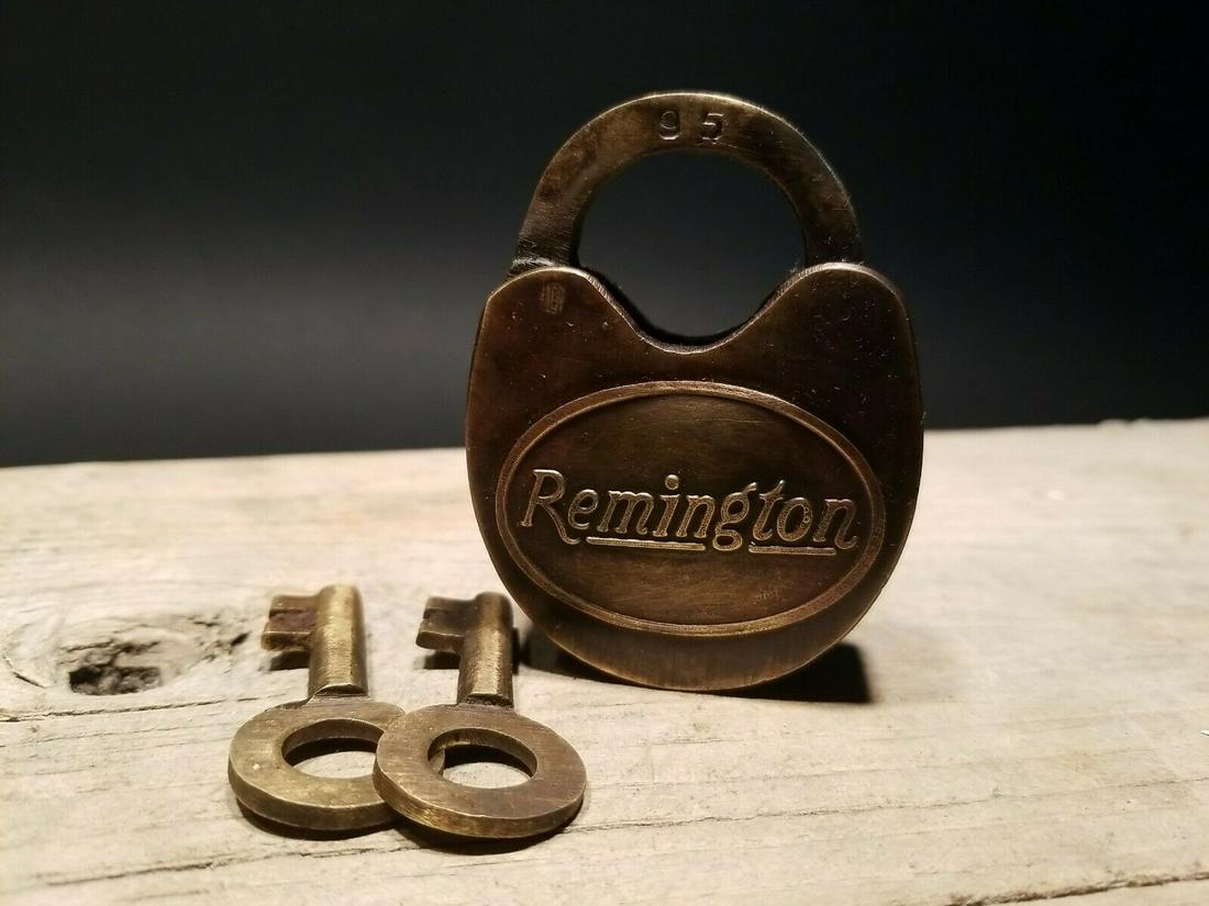 Cast Iron Remington Firearms Ammo Box Padlock Lock &: 3" tall x 2" Wide the shank is 3/8" at its thickest Nice reproduction cast iron Remington padlock! This lock is fully functional! Hard to tell its age. Heavy iron and brass. Great aged patina througho