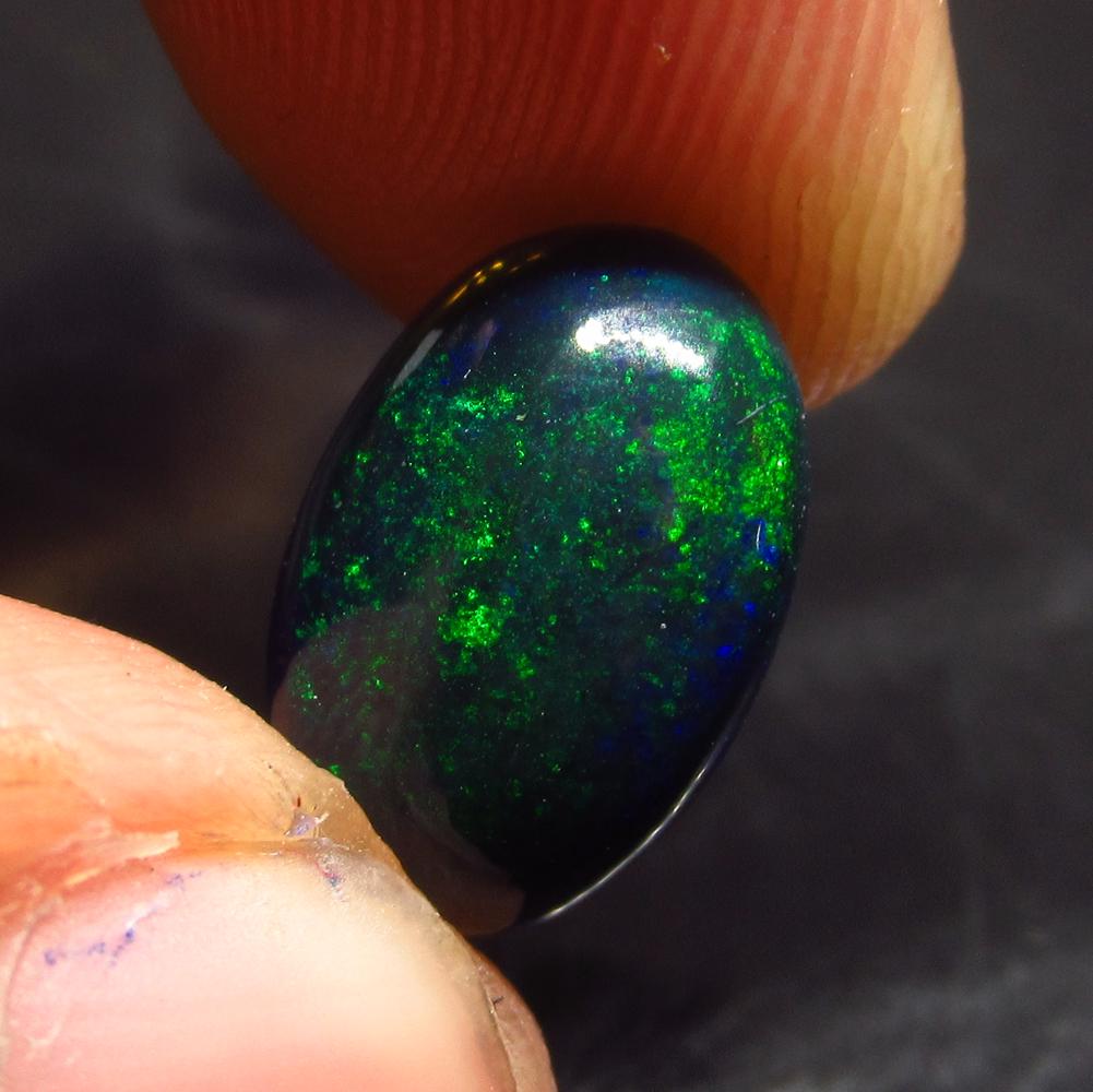 2.57 Ct Natural Ethiopian Black Fire Opal Oval Cab: No Reserve! Title: 2.57 Ct Natural Ethiopian Black Fire Opal Oval Cab Stone Clarity: Translucent Gemstones: Natural Black Opal Carat Weights: 2.57 Size/Dimensions: 12.50 x 8.30 x 5.00 mm Additional In