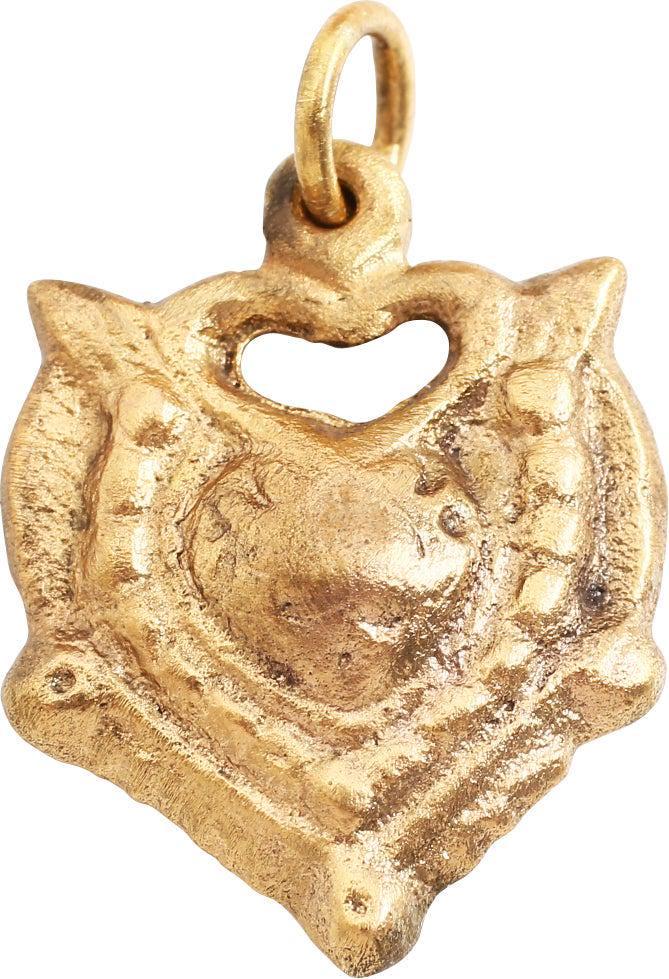 EXCEPTIONAL VIKING HEART PENDANT, 10TH-11TH C. AD: Over 7/8” height. Cusped form heart with the cusp formed by a second heart. A heart within a heart! scalloped borders and the quarter points with radials, forming a saltire. Well preserved with the 