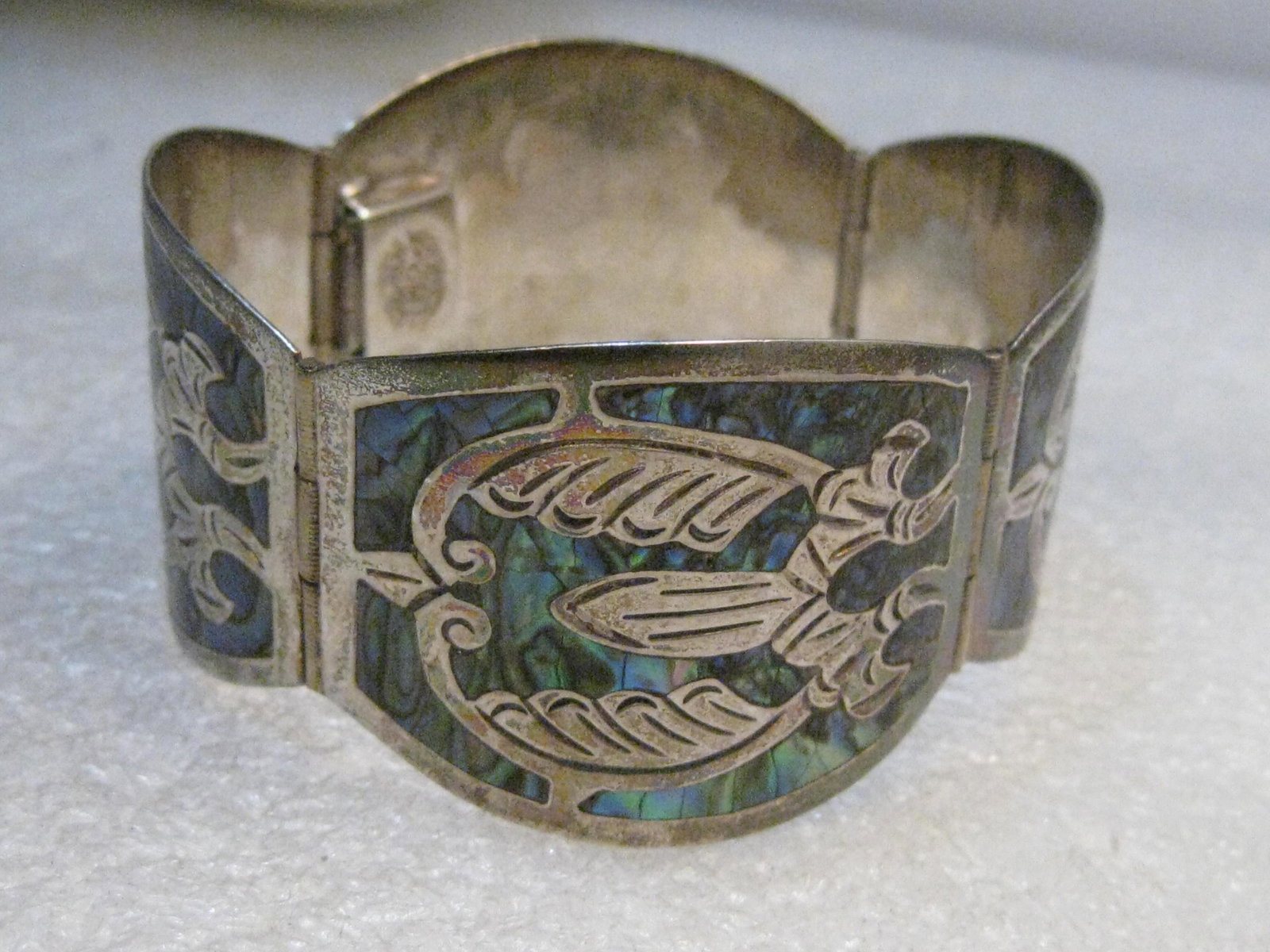 Mexico Sterling 4 Panel Bracelet, Inlaid Abalone, 7",: Sterling Inlaid Abalone Mexico Bracelet, Aztec Inlaid design - 7" long and 1 3/8" wide (at the center of the link) bracelet - the bracelet has four panels. It is signed TJB in the center of the stamp,