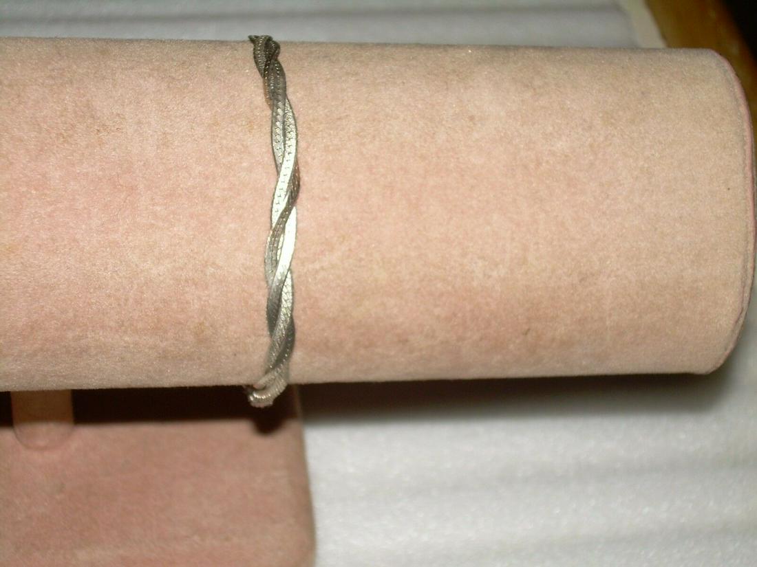 Vintage Italian Sterling Herringbone Bracelet - Triple: Vintage Italian braided herringbone woven chain bracelet measuring 7" in length and marked 925 and Italy on the clasp. The bracelet has a spring clasp. This beautiful triple weave herringbone pattern 
