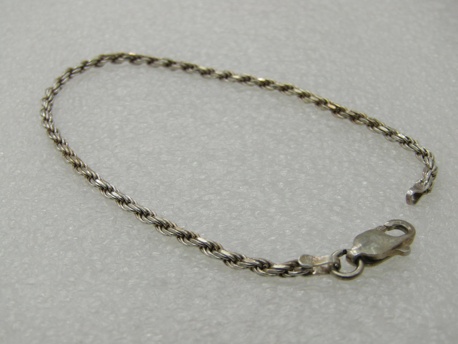 Vintage Sterling Silver Rope Chain Bracelet, 7", 2mm,: Vintage Sterling Silver Rope Chain Bracelet, 7", 2mm, Unisex, appx. 3.52 gr., lobster clasp. Marked 925, tested, signed with a Y in a circle and Italy, Very good condition. (INV.WCOV.6 SS1754 LD 6/28/