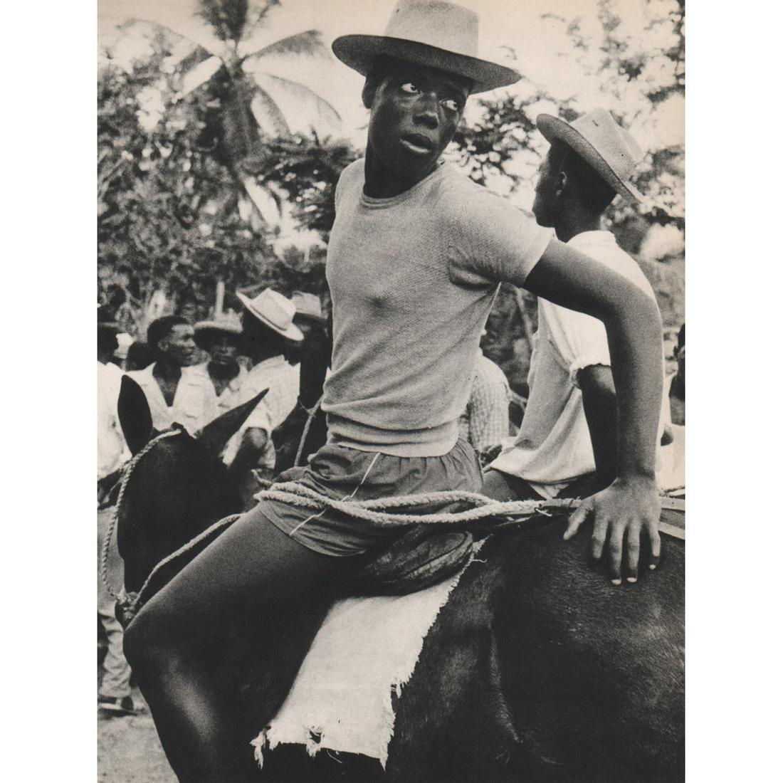 HERBERT LIST - Man on a Burro, Martinique: Artist: HERBERT LIST Print Title: Man on a Burro, Martinique Medium: Sheet-fed Gravure Printing Date: 1980's Printed in Japan Image Size approx: 10 x 7.5 inches Herbert List (1903-1973) was a German p