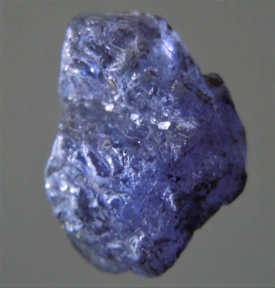 3.6 CT BLUE TANZANITE - UNTREATED GEMSTONE: Title: 3.6 CT BLUE TANZANITE - UNTREATED GEMSTONE Origin: Merelani, Arusha Dist. Tanzania Size: 1.1x0.8x0.5 cm / 0.72 gram slightly translucent, blue tanzanite with structured surface Reserve: $6.00 S