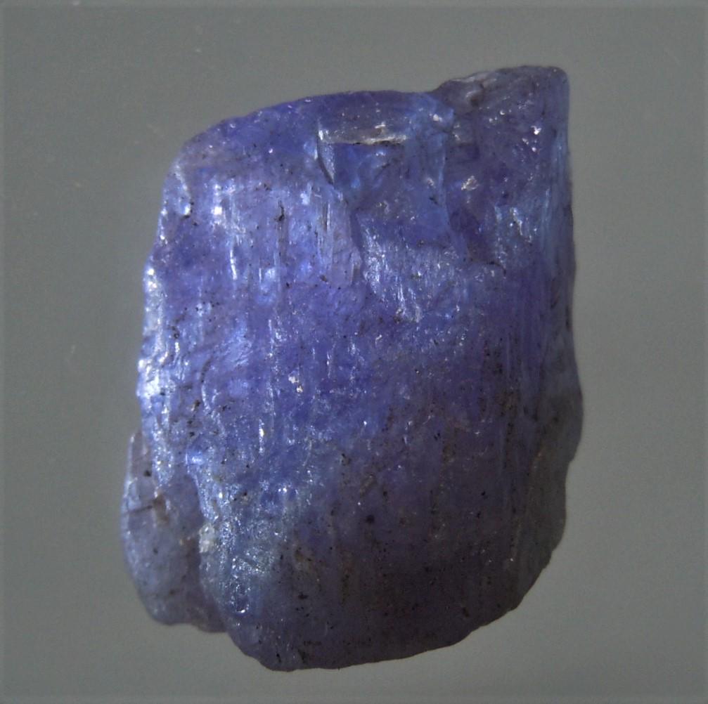 8.6 CT BLUE TANZANITE: Title: 8.6 CT BLUE TANZANITE Origin: Merelani, Arusha Dist. Tanzania Size: 1.5x1.1x0.6 cm / 1.72 gram blue, translucent tanzanite Reserve: $9.00 Shipping: Domestic: Flat-rate of $6.00 to anywhere with