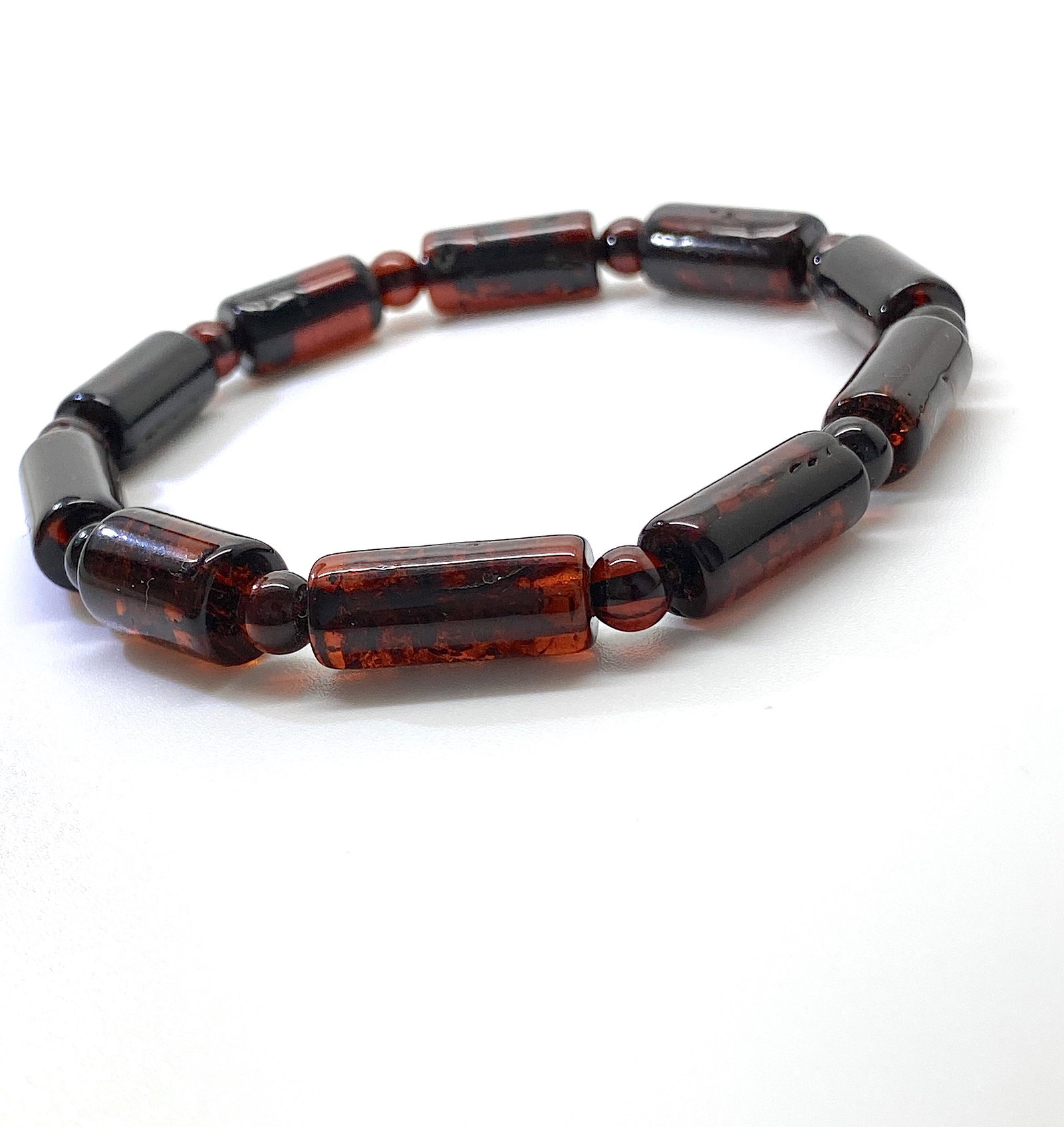 Extraordinary Amber Bracelet made from Barrel shaped: Title: Extraordinary Amber Bracelet made from Barrel shaped Amber beads Metal: None Gemstones: Amber Weight: 6.2 g Size: Bead size: 7.0 x 16.5 mm Bead size: 0.276 x 0.65 inches Made of: Whole Stone Ad