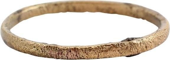 ANCIENT VIKING WEDDING RING SIZE 7 1/4: Late 9th-early 11th. Gilt bronze, size 7 1/4. 1.9mm band, rounded face. Surface textured from burial. Professionally refurbished with the 24karat gold overlay restored. Gift boxed with a certificate o
