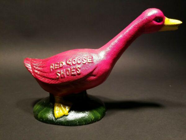 Cast Iron Red Goose Shoes Coin Bank: 9 1/2" long x 6 1/2" tall Such a charming reproduction cast iron "Red Goose Shoes" statue coin bank. Nice quality! All solid cast iron hand painted. As you can see the coin slot is located on the top 